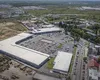 Gigantul străin care face valuri în România. Cumpără pe bandă rulantă și promite investiții masive în țara noastră