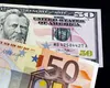 Apreciere istorică a monedei euro în raport cu dolarul. Cum vor resimţi românii schimbarea raportului de forţe de pe pieţele financiare