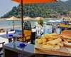 Nota de plată din Grecia care i-a lăsat fără cuvinte pe doi români. Cât au plătit pentru un prânz în Thasos: „Ne-am autodepășit!”