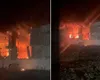 Incendiu violent în județul Iași! O hală de mii de metri pătrați unde se află butelii și butoaie cu motorină arde