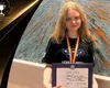 La doar 18 ani, românca care a cucerit două medalii mondiale de aur scrie deja cărți pentru alți elevi