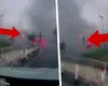 Imagini spectaculoase: o tornadă ridică o mașină în aer și o aruncă în afara șoselei. Momentul a fost surprins de camerele de bord VIDEO