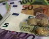 Se schimbă banii. De când se plătesc salariile în euro, iar magazinele nu mai primesc cash în moneda locală