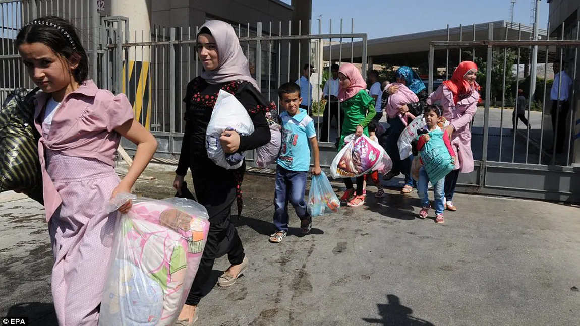 Mii de civili şi sute de voluntari în pericol, în Siria, după ce SI a atacat o enclavă a rebelilor