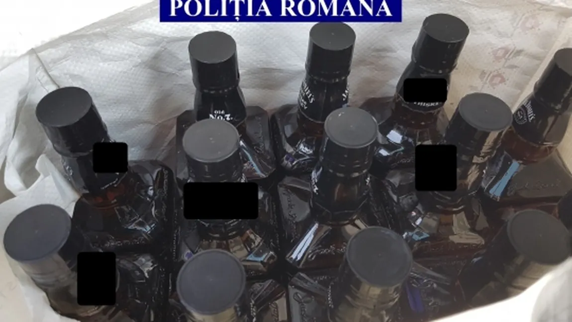 Bărbat care cumpăra sticle goale de whisky pe care le umplea cu alcool şi le vindea ca produs original, cercetat de poliţişti