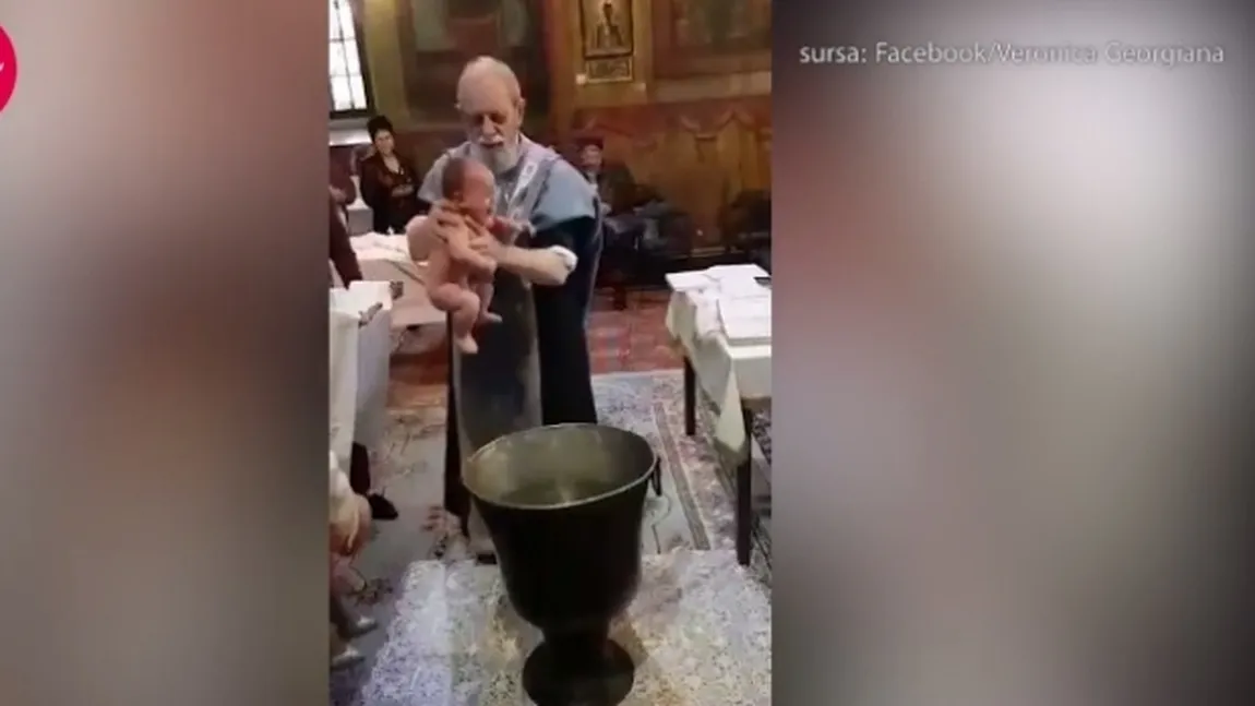 Anchetă după ce un preot a fost filmat bruscând un copil în timpul slujbei de botez