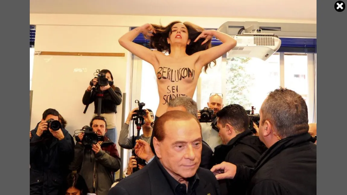 Alegeri în Italia. O femeie a protestat topless faţă de Berlusconi, numindu-l 