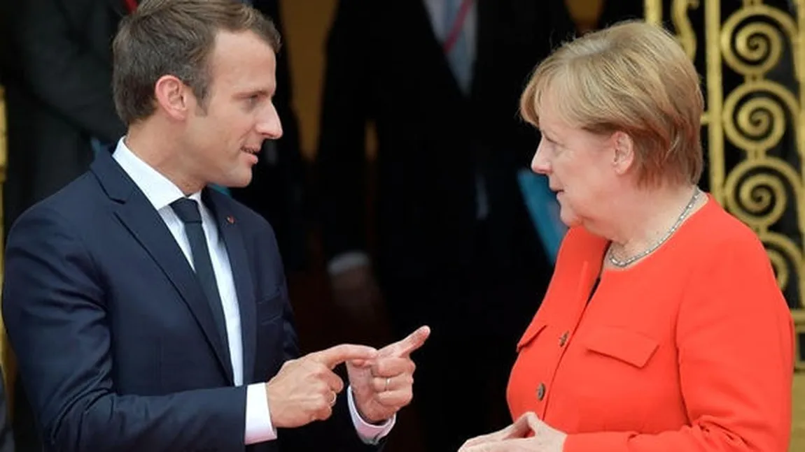 Macron şi Merkel cer acorduri între mai multe ţări privind migraţia