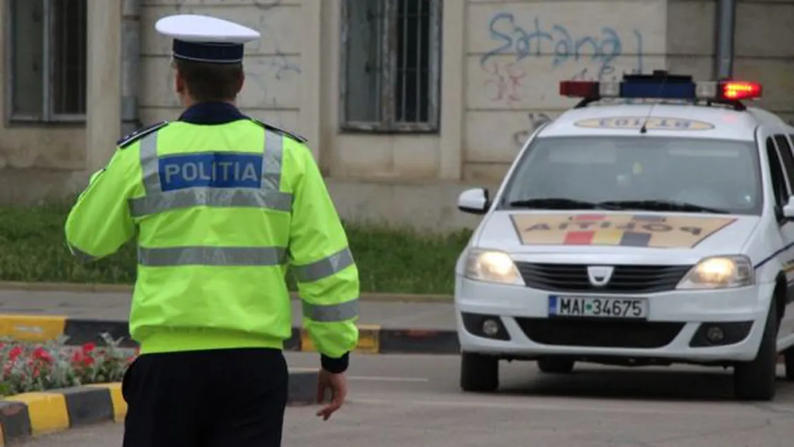 Poliţist târât cu maşina de un şofer beat şi fără permis