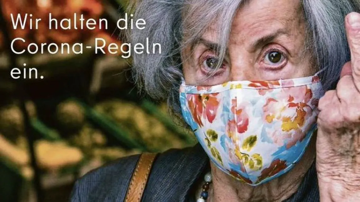 Coronavirus. Controverse la Berlin, după o reclamă în care o bătrână le arată degetul mijlociu celor care nu poartă mască FOTO