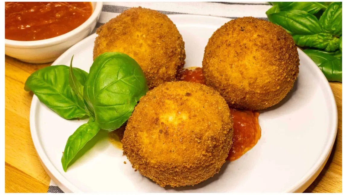 Cum să faci Arancini. Preparatul italian cu orez și carne care te va da pe spate