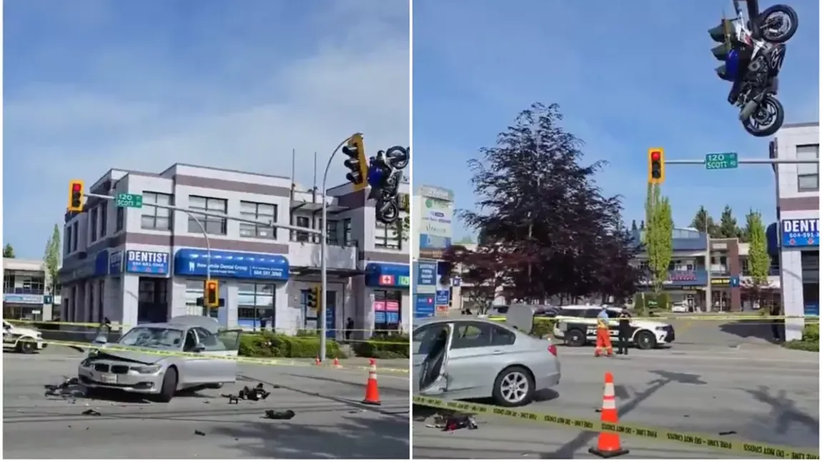O motocicletă a rămas suspendată de un semafor într-o intersecţie după un accident. 