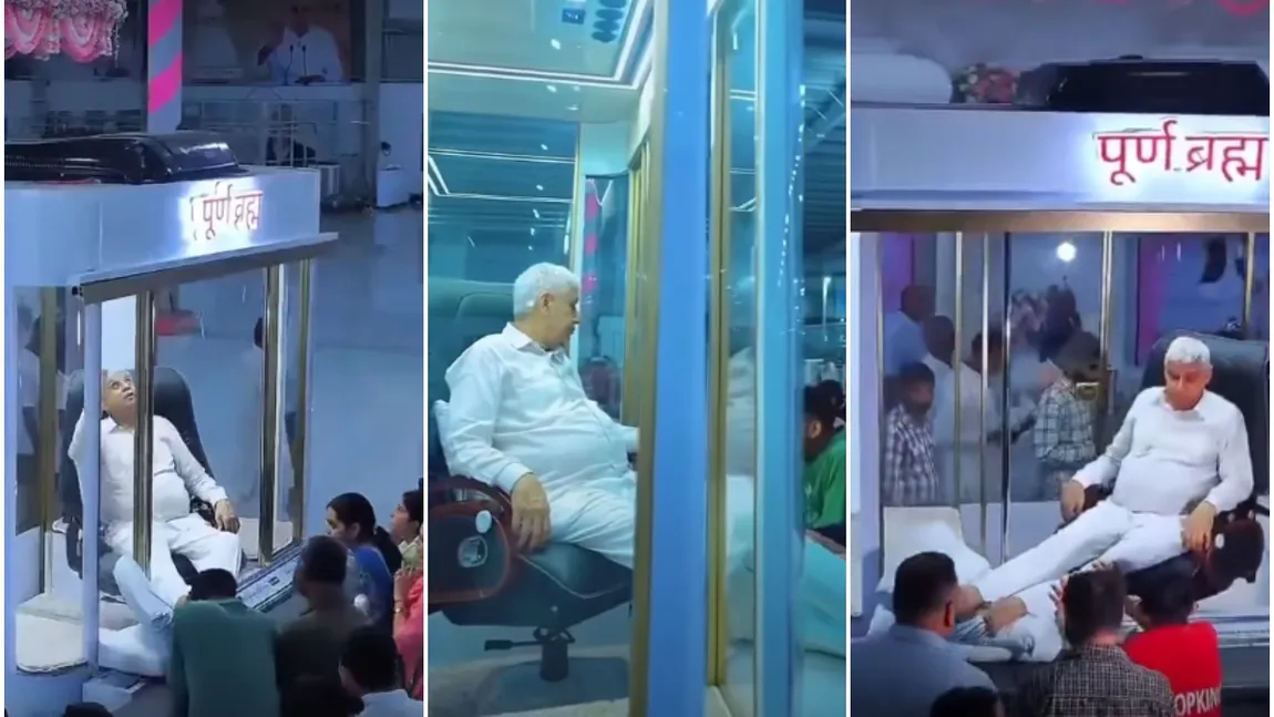 Imagini virale! Un guru indian își primește adepții dintr-o cabină cu aer condiționat și pereți din sticlă, în timp ce aceștia îi sărută picioarele. VIDEO