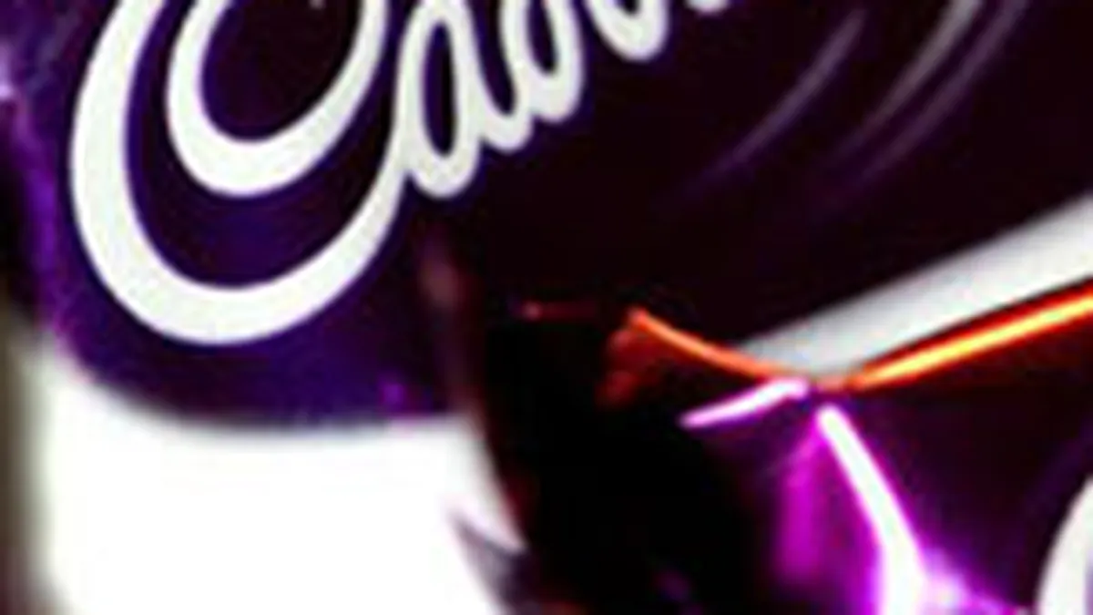 Cadbury face un nou efort de respingere a ofertei Kraft, anuntand vanzari si dividende in urcare