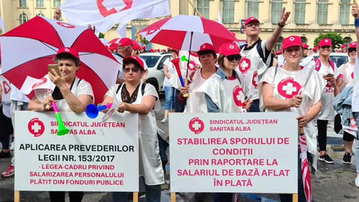 Membrii Sanitas pichetează astăzi la Ministerul Muncii şi Ministerul Energiei