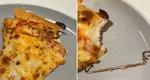 O femeie a găsit o bucată de metal într-o pizza comandată de la un celebru lanț de restaurante