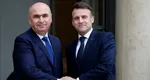 Bolojan pe urmele lui Iohannis. O nouă vizită externă la Paris. De ce se duce președintele interimar din nou la Macron