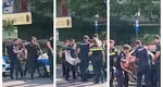 Scene halucinante în centrul Capitalei. Un bărbat a fost legat și luat pe sus de polițiști după ce și-a agresat soția