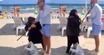 Administrator de plajă, mușcat, fugărit printre șezlonguri și bătut cu bastonul de o bătrână cerșetoare VIDEO