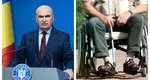 Guvernul Bolojan, criticat aspru după ce a tăiat ajutoarele persoanelor cu dizabilități: ”Ce se întâmplă acum este strigător la cer”