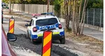 Mașină de poliție blocată în betonul proaspăt turnat. Cum explică polițiștii
