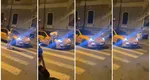 Porsche transformat în trecere de pietoni, după ce șoferul nu i-a oferit prioritate unei femei. S-a urcat pe capota mașinii și și-a văzut mai departe de drum