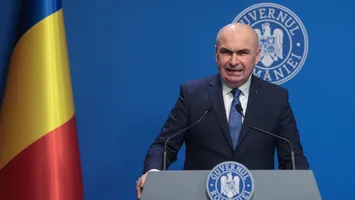 Ce șanse sunt să ”pice” Bolojan în urma moțiunii. De câte voturi au nevoie PSD și AUR