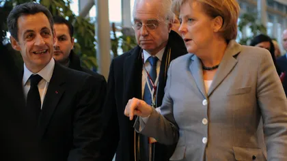 Sarkozy şi Merkel negociază tăierea cu peste 50% a datoriilor Greciei