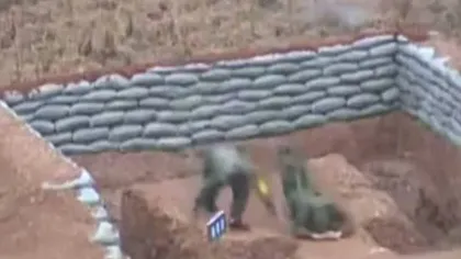 Un militar chinez, la un pas de moarte după ce a scăpat din mână o grenadă VIDEO