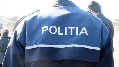 Un poliţist din Alba a fost lovit cu toporul în cap