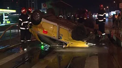 Accident în Capitală. Un şofer de taxi s-a răsturnat cu maşina VIDEO