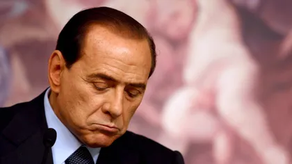 Berlusconi, huiduit de zeci de manifestanţi