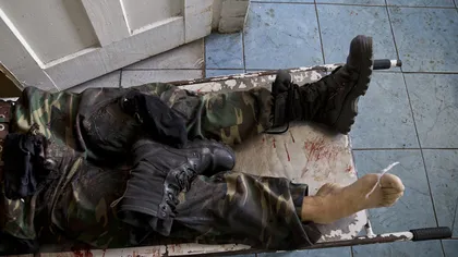 Imagini cutremurătoare în Ucraina: Cadavrele militanţilor separatişti au umplut morgile VIDEO