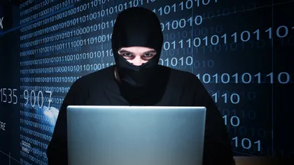 Percheziţii la doi hackeri, suspectaţi că au spart site-ul Poliţiei Române