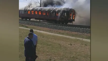 PANICĂ ÎN GARĂ. Un tren a fost cuprins de flăcări. 80 de pasageri, evacuaţi de urgenţă VIDEO