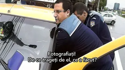 Circ în stradă între un taximetrist şi doi agenţi de poliţie. Imagini desprinse parcă dintr-un film VIDEO