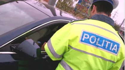 Poliţist muşcat de mână de soţia unui şofer pe care l-a oprit în trafic