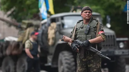 Germania i-a cerut Rusiei să îi determine pe separatiştii ucraineni să îşi retragă armele de pe linia frontului