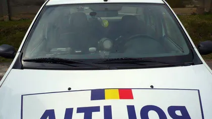O maşină a poliţiei care transporta o persoană la audieri la Bucureşti, implicată într-un accident rutier