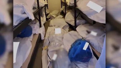Imaginile morţii! Cadavre îngrămădite şi depozitate unele peste altele într-o încăpere a spitalului din Detroit