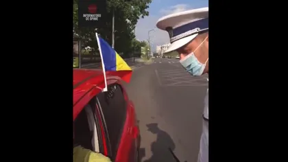 Şoferiţă oprită în trafic de Poliţie, pentru că avea agăţat de maşină un steag: 