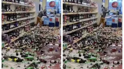 Dezastru într-un supermarket! A spart sute de sticle de băuturi alcoolice de pe rafturi și a aruncat cu ele și în clienți