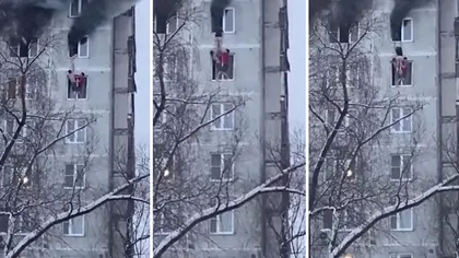 Scene şocante! O tânără coboară dintr-un apartament cuprins de flăcări, aflat la 27 m înălţime, în cel de dedesubt. VIDEO