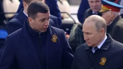 Un bărbat văzut alături de Putin la ceremonia de Ziua Victoriei a aprins zvonurile despre succesiunea la conducerea Rusiei