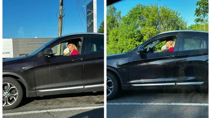 Pe culmile inconștienței! O șoferiță s-a urcat la volanul unui BMW cu bebelușul în brațe, pe DN1: 