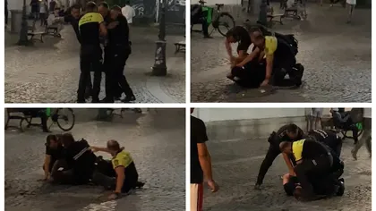 Cum s-au chinuit patru polițiști să încătușeze un bărbat scandalagiu. Agenții au căzut unii peste alții. Scene de cascadorii râsului în Centrul Vechi din Capitală