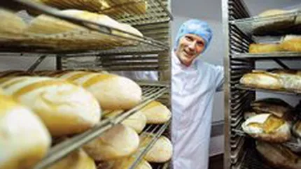 Romanii mananca paine la negru de 1 miliard de euro
