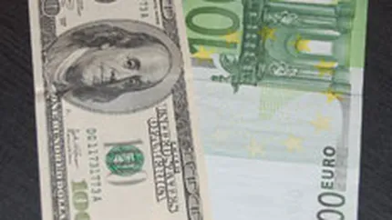 Euro s-a depreciat vineri in fata dolarului la un nou minim al ultimelor 14 luni