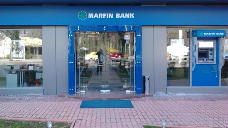 Clienţii de la Bank of Cyprus îşi pot ridica banii începând de luni de la Marfin Bank