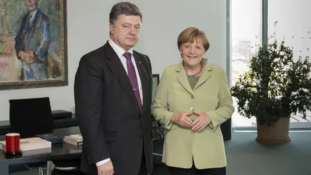 Poroşenko şi Merkel au discutat despre încălcarea regimului de încetare a focului în Donbas